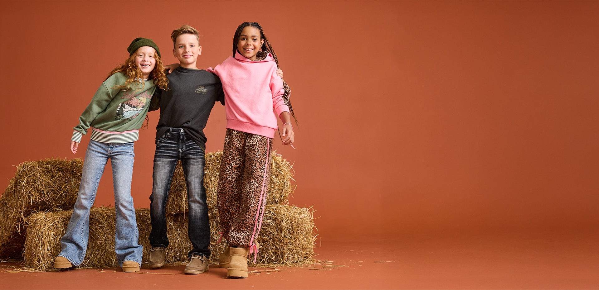 A group of kids wearing the latest styles at Buckle.