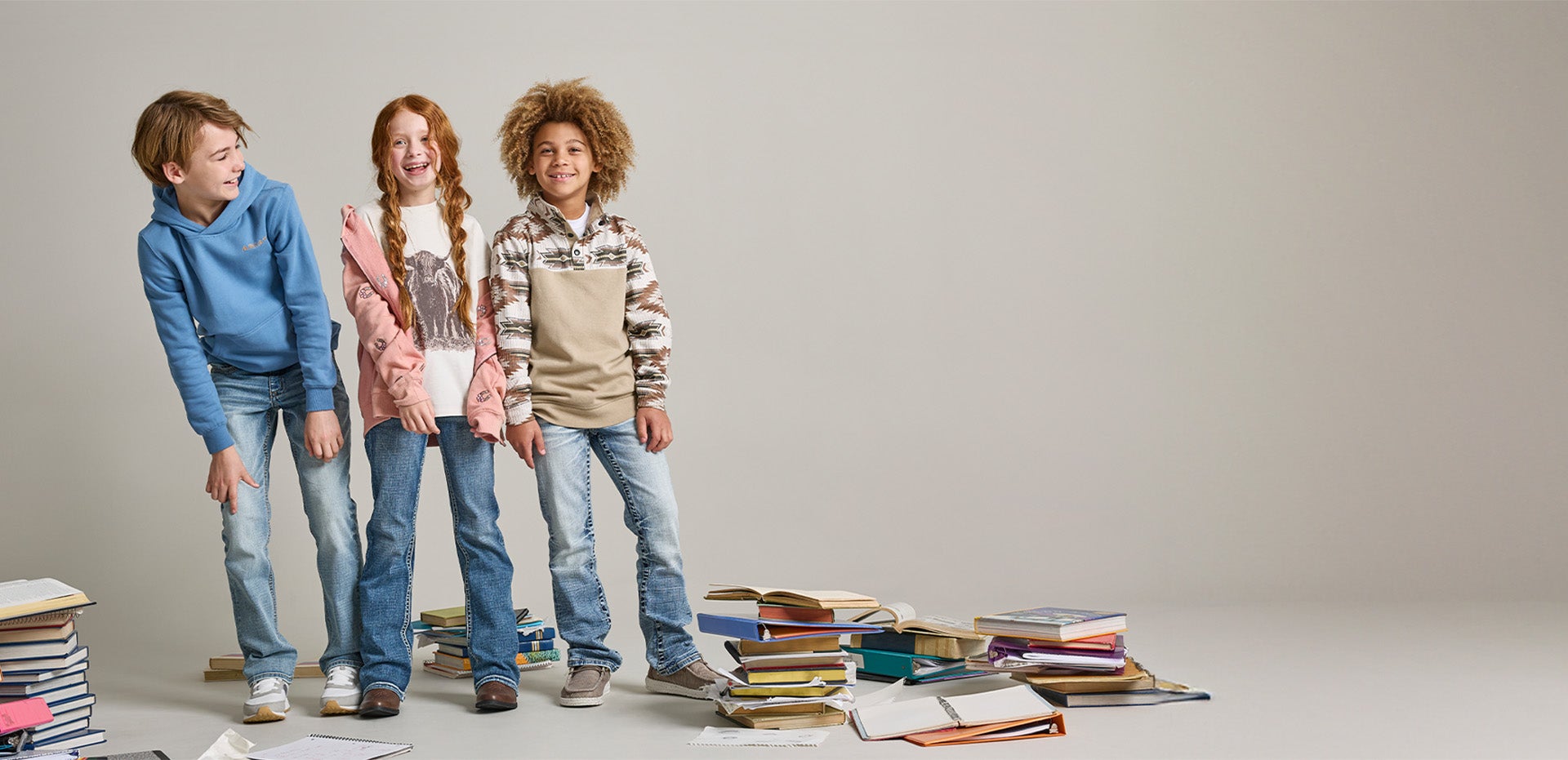 A group of kids wearing the latest styles at Buckle